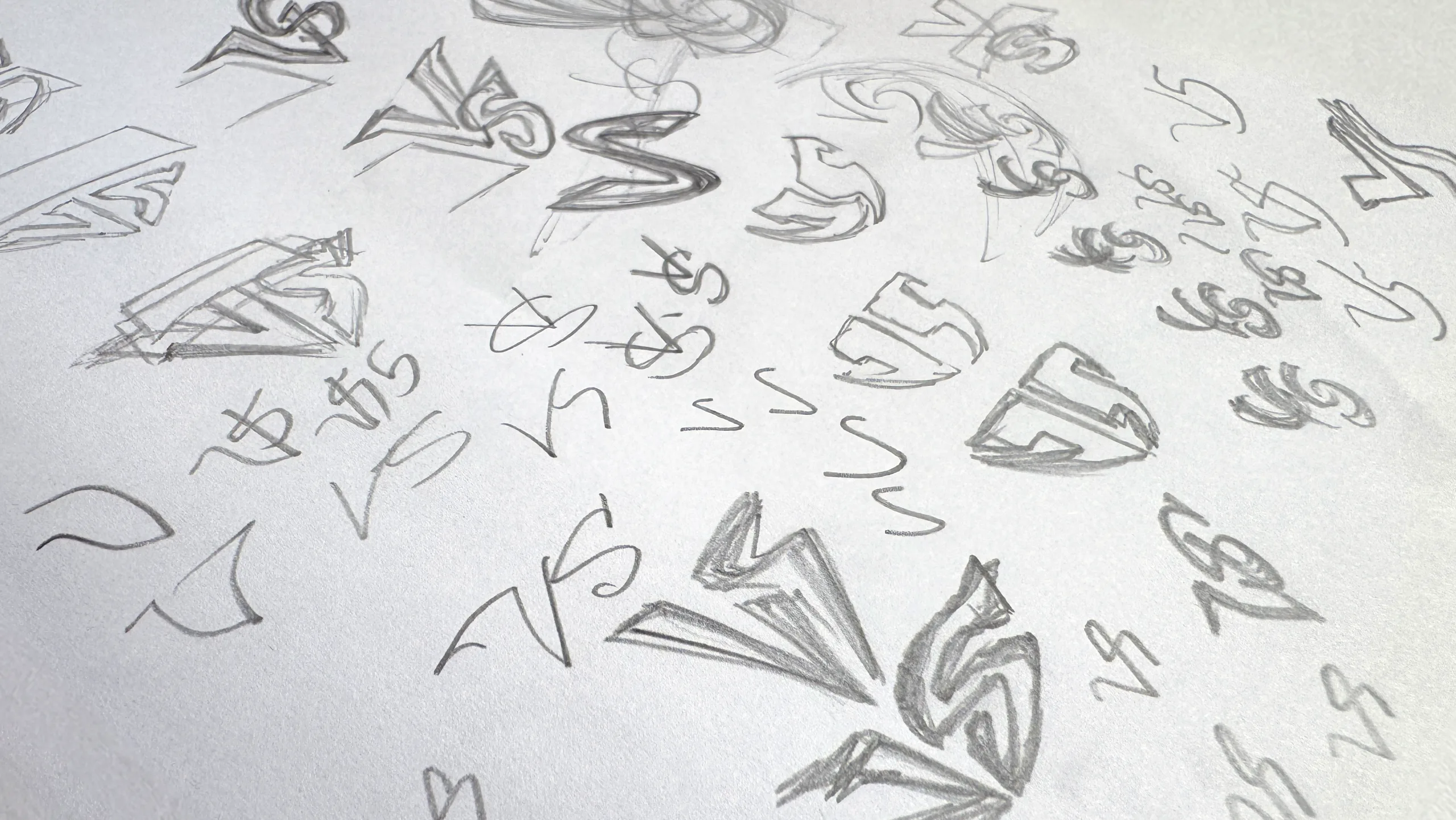 Pencil sketches of Invincible VS logo explorations